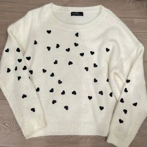 NWT. Heart Sweater. White with black . Size small .
